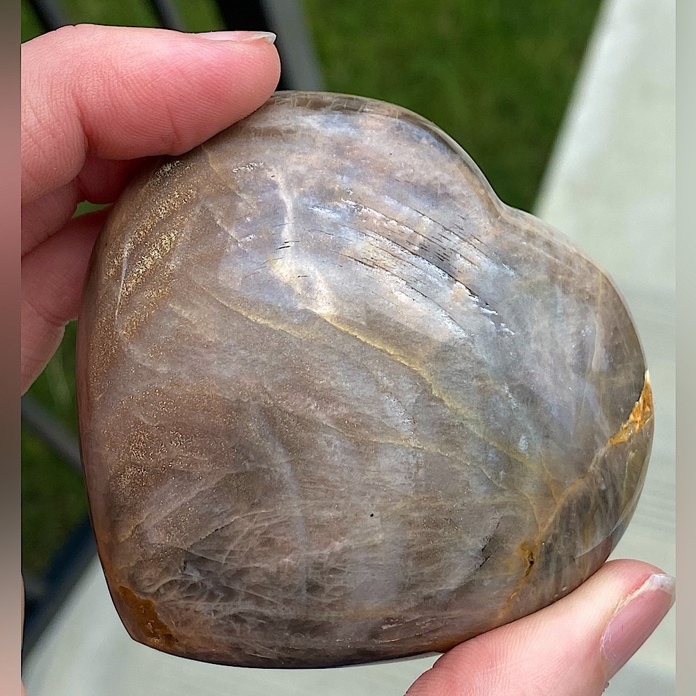 Black moonstone heart crystal with shimmering chatoyancy